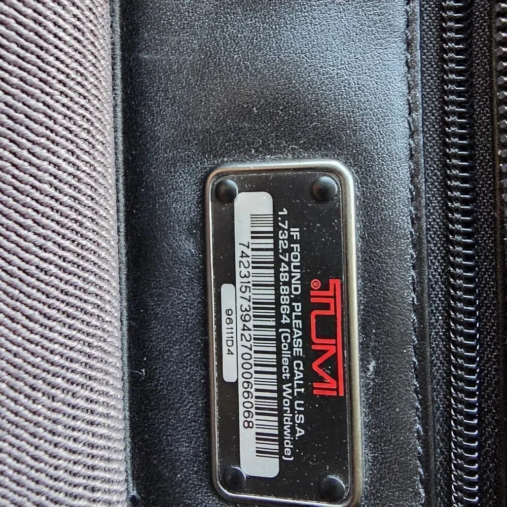 Tumi black leather briefcase